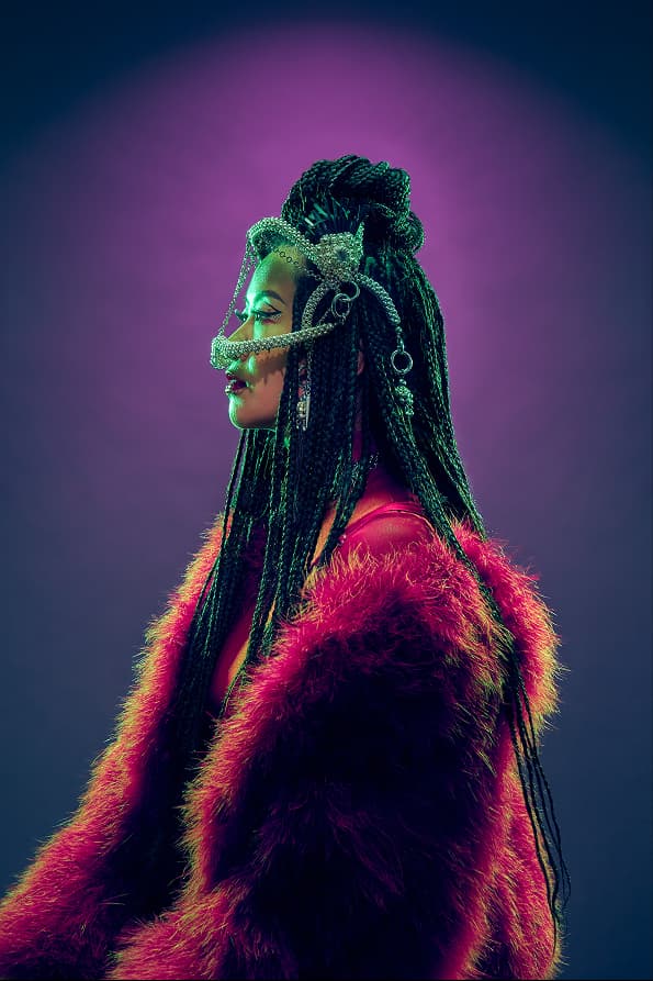 Portrait of Masia One in red fur, profile view